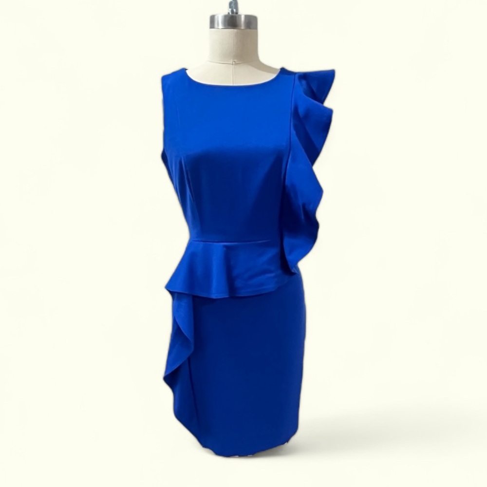 Y2K era 80s inspired office to evening dress with huge asymmetrical ruffle.